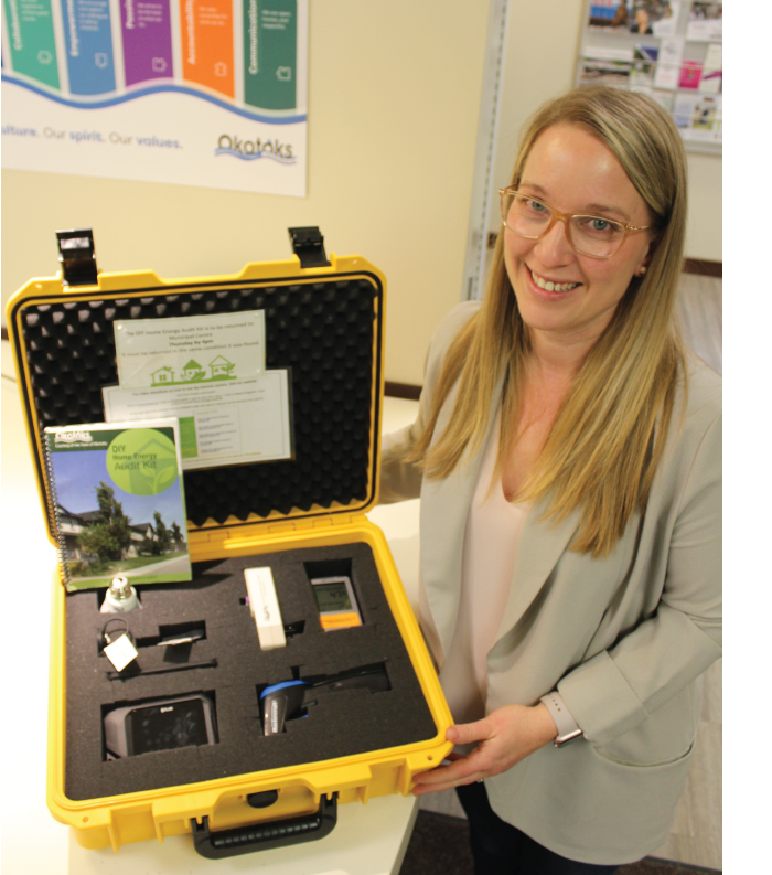 lady holding a box open to reveal DIY kit devices