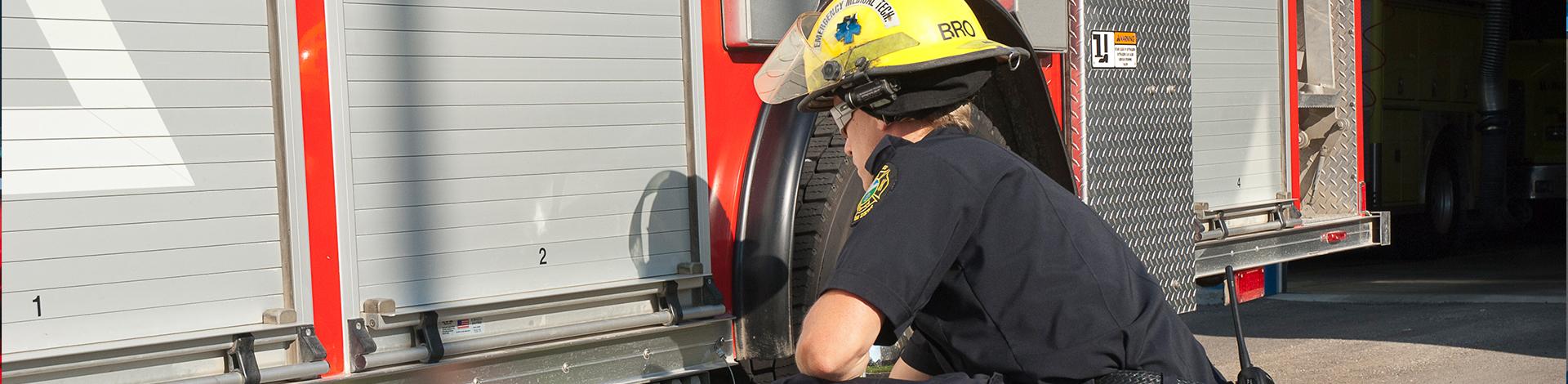 Firefighter working on truck