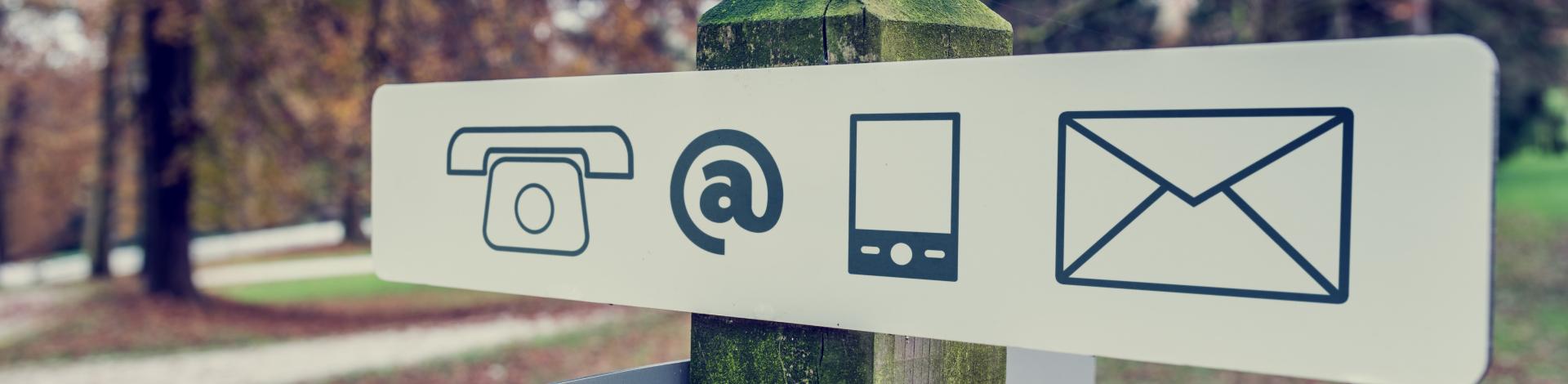 Contact us symbols on sign in park