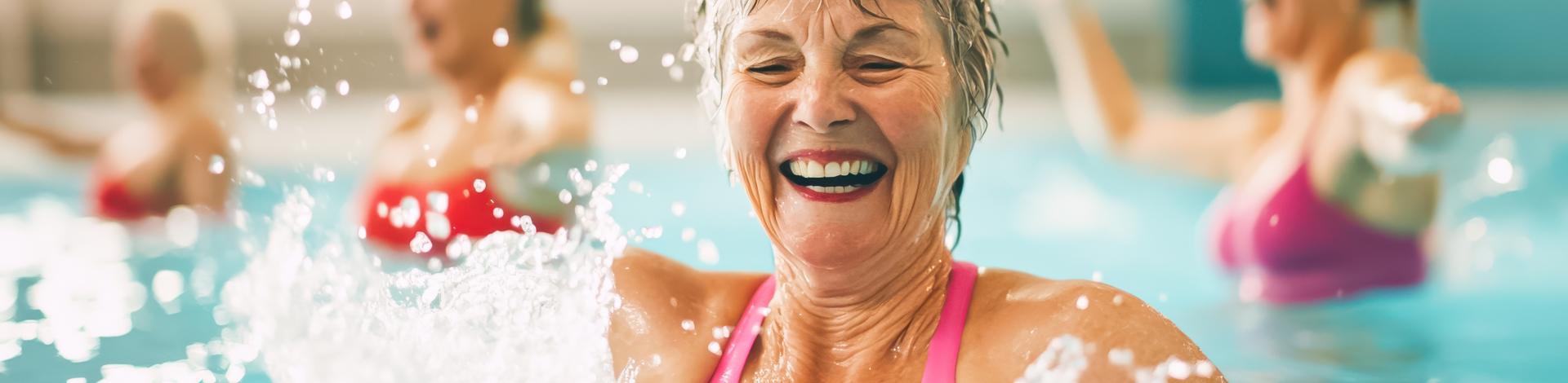 women smiling in swimming pool