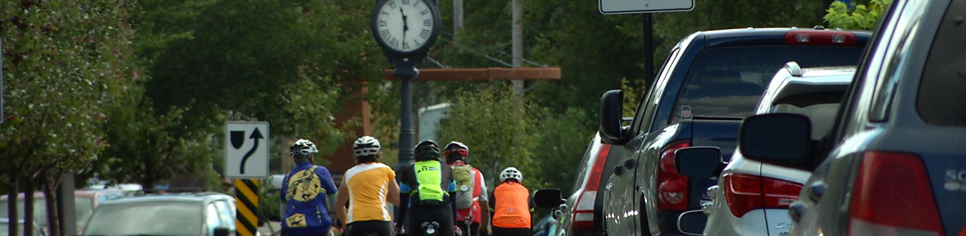 Downtown Okotoks with clock and urban cyclists