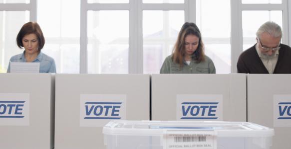 People voting at election ballot box stations