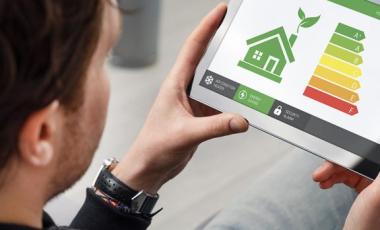 person holding ipad with energuide chat displayed