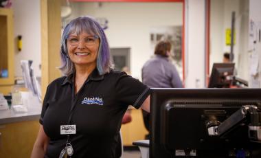 Women smiling by front counter at recreation centre