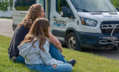 two girls waiting for the bus