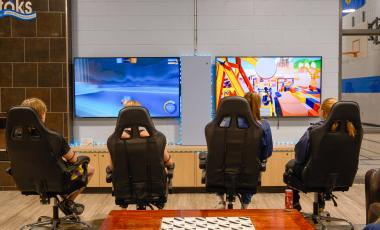 teenagers playing video games