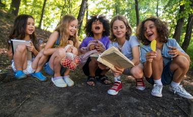 Group of smiling kids in trees