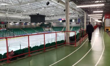 adults walking on indoor walking track