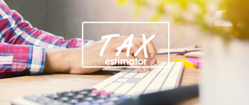 Tax estimator - man typing on computer keyboard with calculator in foreground