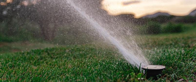 irrigation-system-sprinkles-golf-course