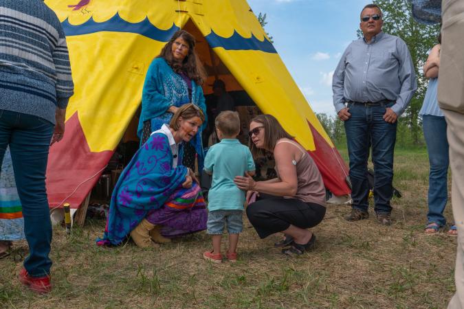 Mayor Thorn in front of Okotoks Tipi at Tipi transfer