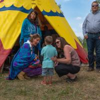 Mayor Thorn in front of Okotoks Tipi at Tipi transfer