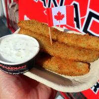 deep fried pickles on a plate 