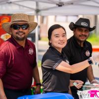restaurant staff serving food samples at Taste of Okotoks 