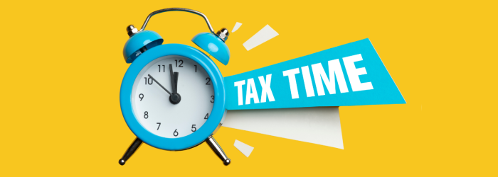 Yellow background with blue alarm clock indicating that it's tax time