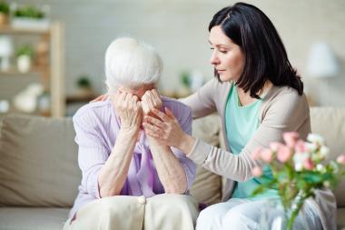 woman comforting senior woman 